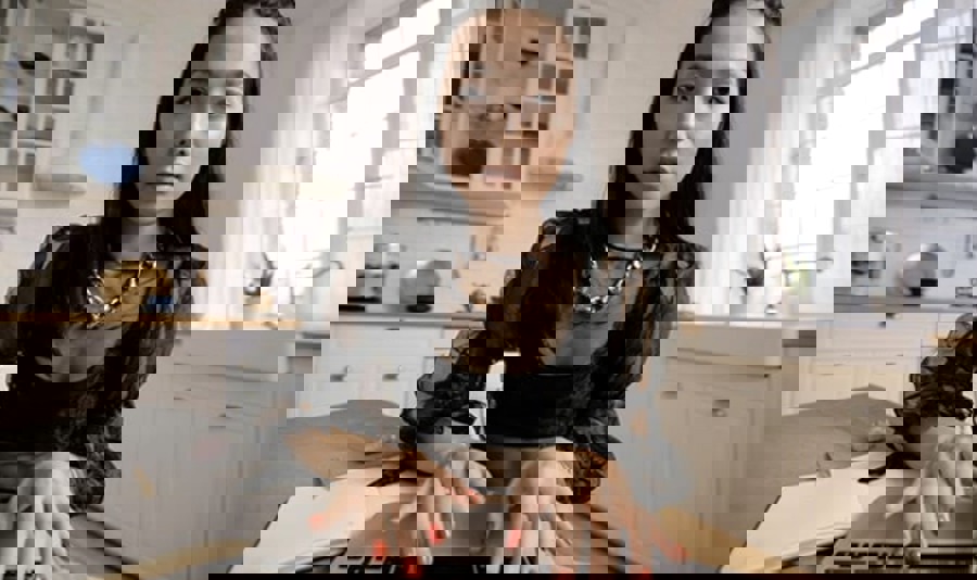 Webcams view of a young stylish woman working on her laptop and looking at her s